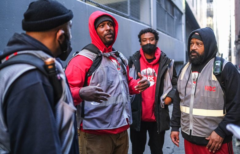 From left, Dershawn Trahan, Renaud Butler, Sadik Malin and Bryan Porter are part of We Deliver Care, an organization that delivers service and assistance to Seattle’s downtown homeless population – mostly along Third Avenue. 223334