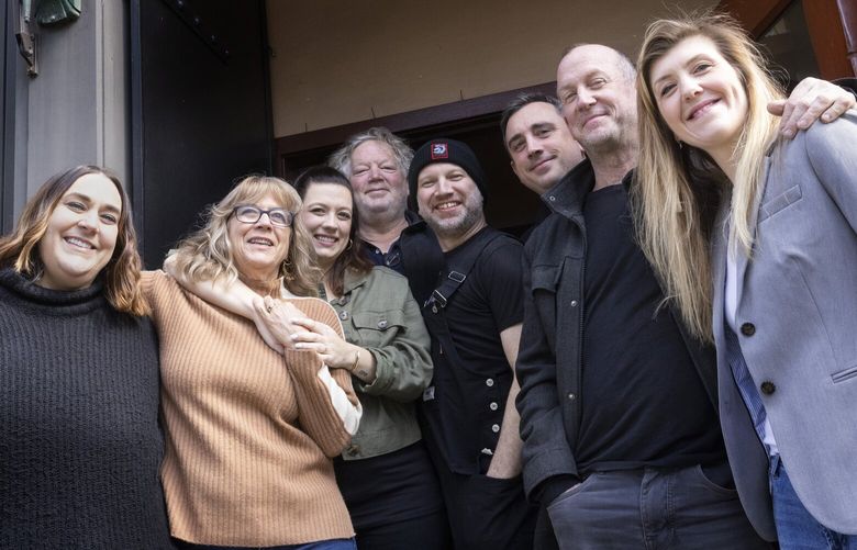 Tom Douglas’ (center) stands with his team in front of the Palace Kitchen in downtown Seattle.  The restaurant is reopening after being closed for three years due to COVID, shot Friday, April 14, 2023.  

L – R
Amy Richardson, director
Jackie Cross, owner
Loretta Douglas, owner
Tom Douglas, owner
Ron Anderson, chef
Brock Johnson, director
Sean Hartley, owner
Kristen Burns, general manager
 223561