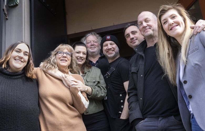Tom Douglas’ (center) stands with his team in front of the Palace Kitchen in downtown Seattle.  The restaurant is reopening after being closed for three years due to COVID, shot Friday, April 14, 2023.  

L – R
Amy Richardson, director
Jackie Cross, owner
Loretta Douglas, owner
Tom Douglas, owner
Ron Anderson, chef
Brock Johnson, director
Sean Hartley, owner
Kristen Burns, general manager
 223561