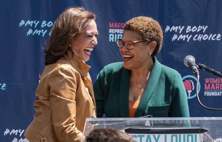 Vice President Kamala Harris, left, is welcomed on stage by Los Angeles Mayor Karen Bass during the Women’s March outside Los Angeles City Hall, Saturday, April 15, 2023. (AP Photo/Damian Dovarganes) CADD612 CADD612