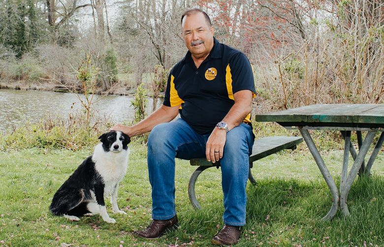 Robert Young, who runs Geese Chasers, with Tink, a 7-year-old Border collie in Moorsetown, N.J., on April 6, 2023. Young explains how the birds can be a menace and why Border collies are his star employees. (Michelle Gustafson/The New York Times)