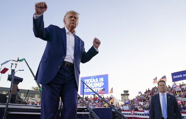 FILE – Former President Donald Trump dances during a campaign rally after speaking at Waco Regional Airport, March 25, 2023, in Waco, Texas. As Trump rails against possible indictment in New York, his team is leaning into a strategy that has quietly become a become a cornerstone of his campaign: releasing made-for-social media videos reacting to the news and outlining his agenda for a second term. (AP Photo/Evan Vucci, File) WX110 WX110