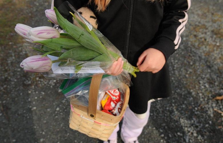 Each year, students distribute flowers, candies, dog treats and other goodies to strangers. MUST CREDIT: The Chilliwack Progress photo by Jenna Hauck