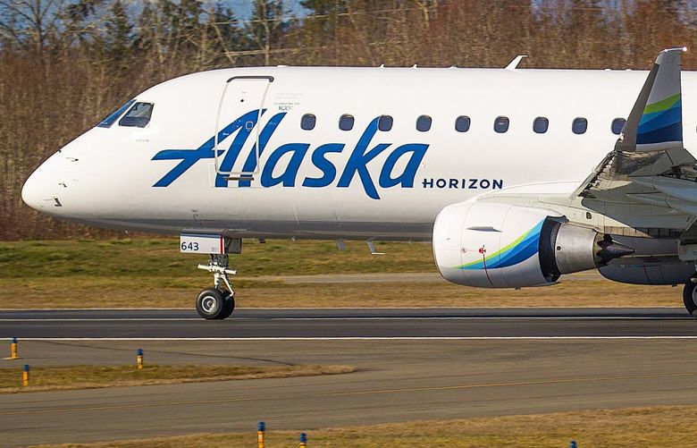 With the Olympic Mountains as a backdrop, an Embraer 175, operated by Alaska’s Horizon Airlines, takes off from Everett’s Paine Field. This is the first passenger flight from the new airport terminal beginning on Monday March 4th, 2019.  209511 209511