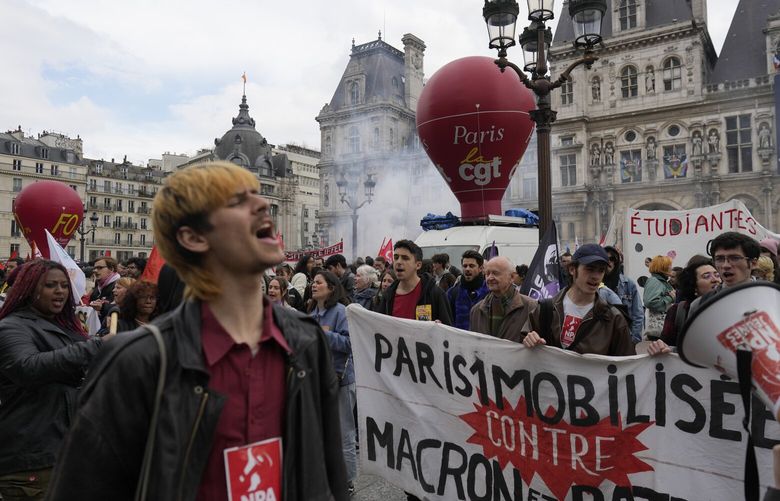 Demonstrators stage a protest against the pension reforms outside the City Hall in Paris, Thursday, April 20, 2023. Union activists stage scattered actions to press France’s government to scrap the new law raising the retirement age. (AP Photo/Thibault Camus) MEU117 MEU117