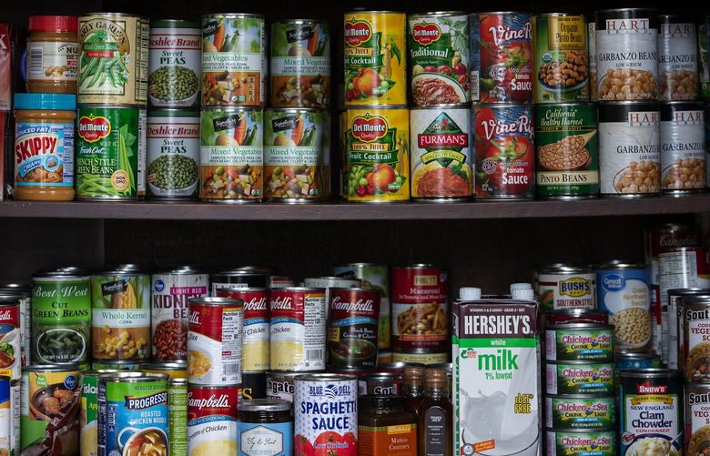 Canned goods available to anyone who needs them at the  North City Little Free Pantry “Share With Your Neighbor” in Shoreline Monday, May 18, 2020.   213972