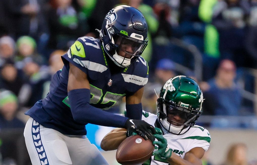 Seattle Seahawks cornerback Tariq Woolen (27) walks off the field after an  NFL football game against the Carolina Panthers, Sunday, Dec. 11, 2022, in  Seattle, WA. The Panthers defeated the Seahawks 30-24. (