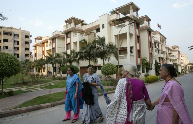 **ADVANCE FOR MONDAY, MARCH 10** Residents of Athashri, a housing complex for senior citizens, greet each other as they take a walk in the evening, in Pune, India, on Feb. 12, 2008.  A cultural revolution is under way in India, led by an unlikely gray-haired vanguard that is dramatically changing what it means to be old here, and what it means to be a family. In a country where family is society’s strongest cultural pillar, the thought of the elderly living alone has long been anathema, but many old people today are embracing the notion. (AP Photo/Gautam Singh) NY370
