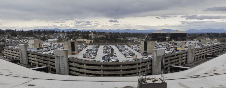 Cars are parked on the top floor of the parking garage at Seattle-Tacoma International Airport. (Ellen M. Banner / The Seattle Times)