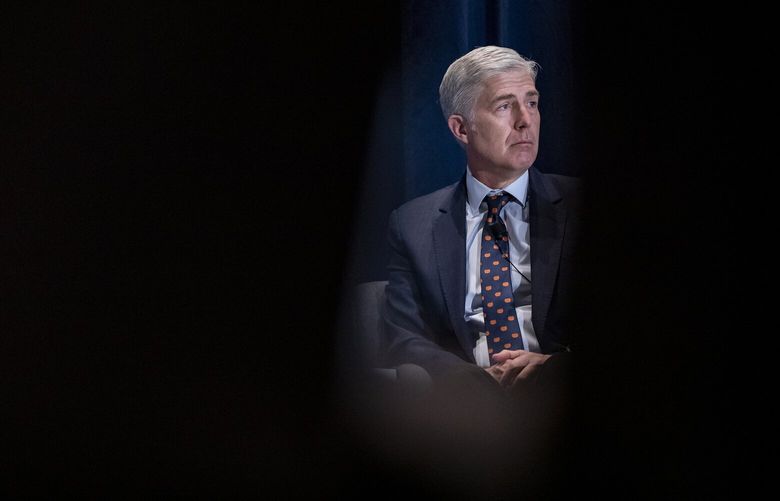 FILE — Supreme Court Associate Justice Neil Gorsuch speaks in Washington, Nov. 16, 2019. One month after Gorsuch was appointed to the Supreme Court in April 2017, he and two partners finally sold a vacation property they had been trying to offload for nearly two years. (Samuel Corum/The New York Times) XNYT181 XNYT181