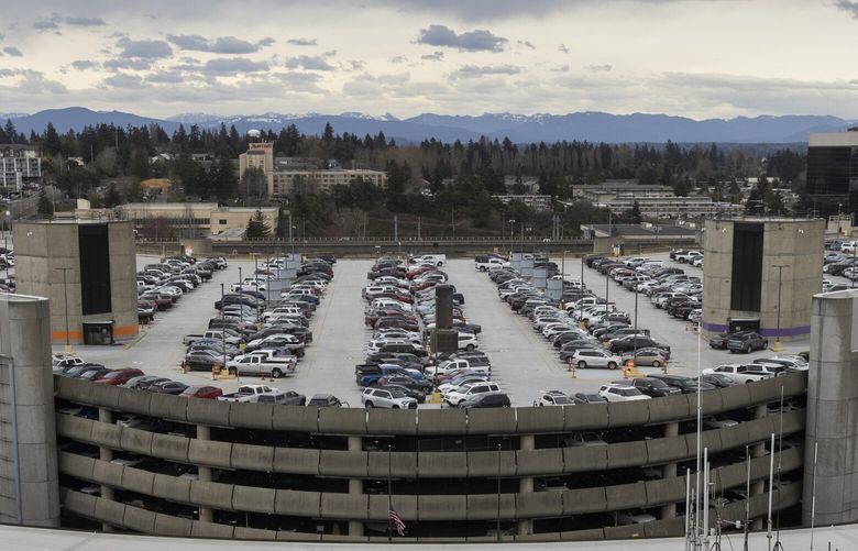 Cars are parked on the top floor of the parking garage at SEA (Seattle-Tacoma International Airport) Thursday, March 28, 2023.   223482