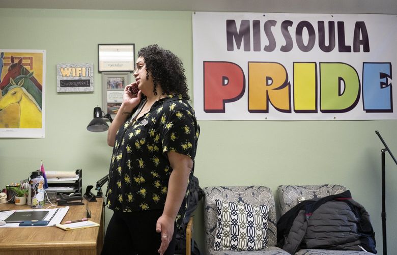Kera Rivera, operations administrator, answers the phone at The Center in Missoula, Mont., Tuesday, April, 25, 2023. The nonprofit provides space, resources and support to lesbian, gay, bisexual, transgender, intersex and non-binary people in Missoula. (AP Photo/Tommy Martino) MTTM207 MTTM207