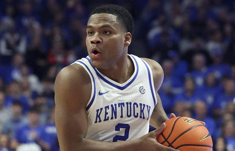 Kentucky’s Sahvir Wheeler (2) is defended by LSU’s Justice Hill during the first half of an NCAA college basketball game in Lexington, Ky., Tuesday, Jan. 3, 2023. (AP Photo/James Crisp)