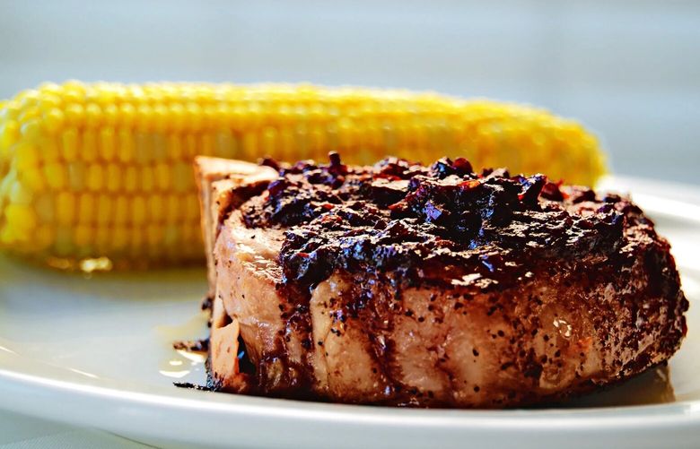 Drizzled over a freshly grilled pork chop, author Susan Mallery’s Blackberry Chipotle Sauce hits the sweet-hot spot. (Seattle Times archive, 2011)