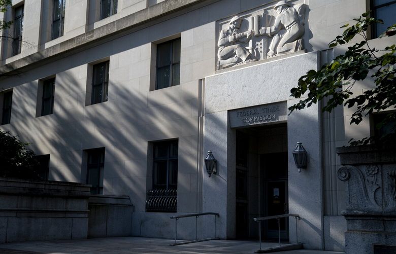 FILE – The headquarters building of the Federal Trade Commission in Washington on Aug. 11, 2021. The FTC says a ban on noncompete clauses could increase wages by nearly $300 billion a year across the economy. (Stefani Reynolds/The New York Times)