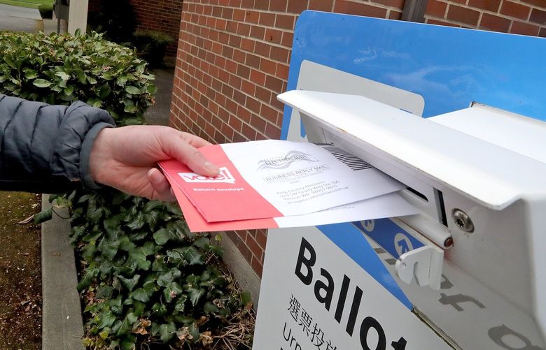 Jim Malzewski (cq) drops off his ballot at the drop box on West Nickerson and 3rd Ave W. 223674