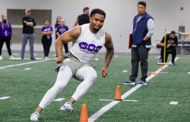 Cam Bright runs through agility drills Wednesday afternoon during Pro Day in the Dempsey Indoor Center at the University of Washington in Seattle, Washington on March 29, 2023.