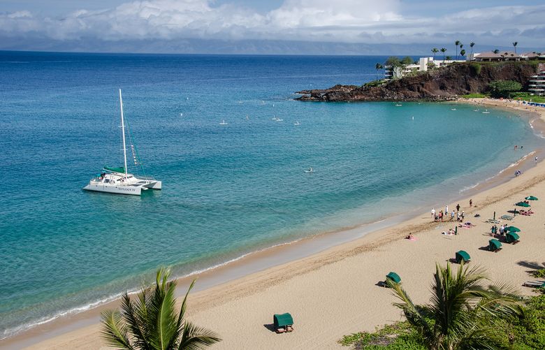 An aerial view of a boat in the waters of Black Rock Beach in Kaanapali.