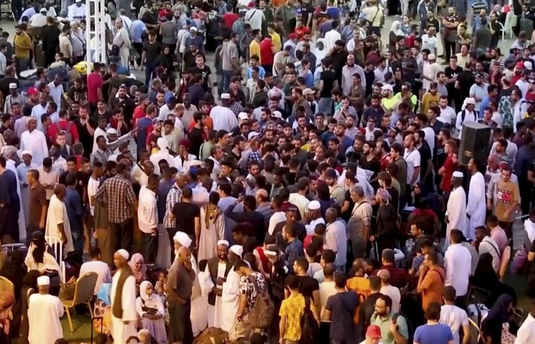 CORRECTS DATE  In this screen grab taken from video, Sudanese and foreigners arrive in Port Sudan, the country’s main seaport, as they wait to be evacuated out of Sudan, Saturday April 29, 2023. Sudanese fleeing the fighting between rival generals in their capital flooded an already overwhelmed city on the Red Sea and Sudan’s northern borders with Egypt, as explosions and gunfire echoed Tuesday in Khartoum. (AP photo/Smowal Abdalla) LGK208 LGK208