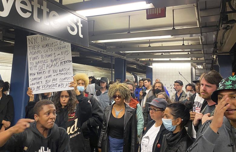 Protesters march through the Broadway-Lafayette subway station  to protest the death of Jordan Neely, Wednesday afternoon, May 3, 2023 in New York. Four people were arrested, police said. Neely, a man who was suffering an apparent mental health episode aboard a New York City subway, died this week after being placed in a headlock by a fellow rider on Monday, May 1, according to police officials and video of the encounter. (AP Photo/Jake Offenhartz) RPJO301 RPJO301