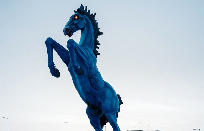 – PHOTO MOVED IN ADVANCE AND NOT FOR USE – ONLINE OR IN PRINT – BEFORE 12:01 A.M. ET ON SUNDAY, APRIL 30, 2023 –   “Mustang,” a 32-foot-tall sculpture by the artist Luis Jimenez that is also known as Blucifer, stands outside Denver International Airport in Denver on Feb. 23, 2023. Some people wonder if it is actually the pale horse of the apocalypse (the one ridden by Death). (Benjamin Rasmussen/The New York Times) XNYT81 XNYT81