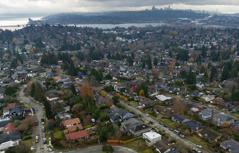 Northeast Seattle homes are seen from the air Tuesday, Dec. 6, 2022. Downtown Seattle is in the background.