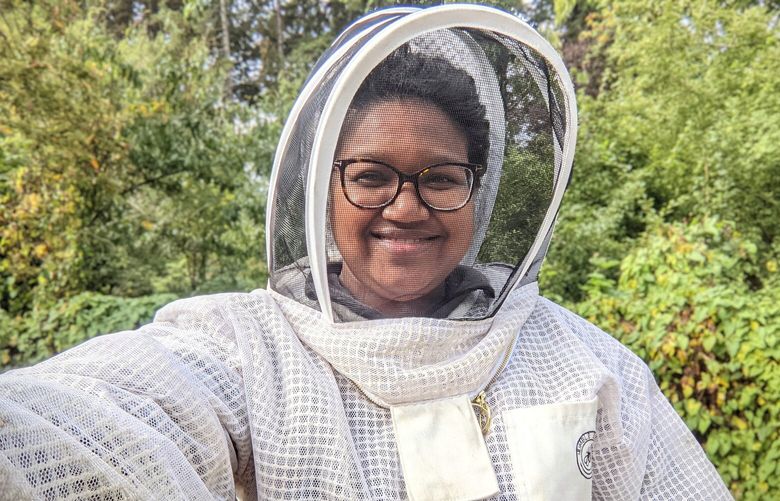 1.	The essay author, Jenn Smith, shares a selfie taken while volunteering with the apiary at the Rainier Beach Urban Farm and Wetlands.