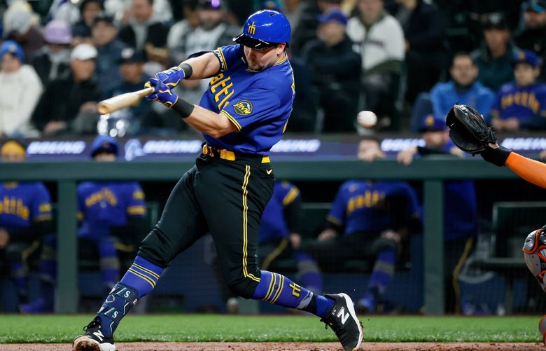 Cal Raleigh swings and misses at a high pitch during the second inning. 223762