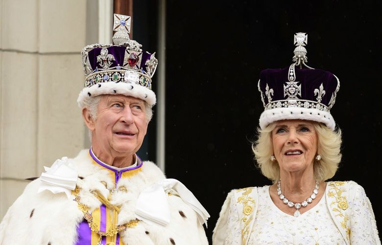Britain’s King Charles III and Queen Camilla stand on the balcony of the Buckingham Palace after their coronation, in London, Saturday, May 6, 2023. (Leon Neal/Pool Photo via AP) ELO271 ELO271