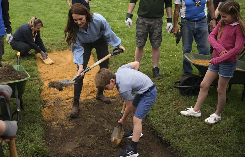 Britain’s Kate, Princess of Wales, Prince Louis and Princess Charlotte take part in the Big Help Out, during a visit to the 3rd Upton Scouts Hut in Slough, England, Monday, May 8, 2023. People across Britain were on Monday asked to do their duty as the celebrations for King Charles III’s coronation drew to a close with a massive volunteering drive. (Daniel Leal/Pool Photo via AP) LLT138 LLT138