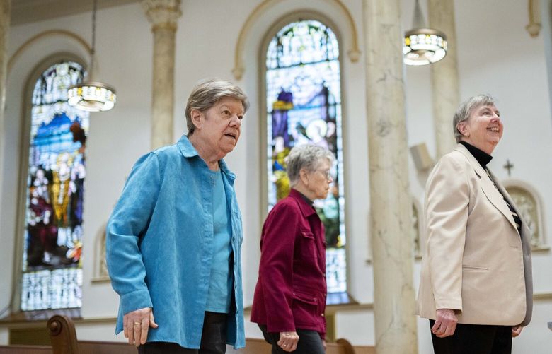 Sisters Donna Dodge, left, Margaret Egan, center, and Margaret M. O’Brien, right, members of the leadership council of the Sisters of Charity, walk into the Chapel of the Immaculate Conception where they took their vows at various times, after an interview at the College of Mount Saint Vincent, a private Catholic college in the Bronx borough of New York, on Tuesday, May 2, 2023. In more than 200 years of service, the Sisters of Charity of New York have cared for orphans, taught children, nursed the Civil War wounded and joined Civil Rights demonstrations. Last week, the Catholic nuns decided that it will no longer accept new members in the United States and will accept the “path of completion.” (AP Photo/John Minchillo) NYJM505 NYJM505