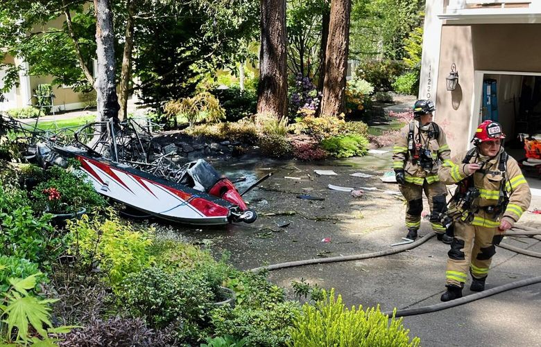 Firefighters arrive at the scene of a float plane crash at the 11200 block of Greystone Drive in Lakewood. Two people are in critical condition and have been taken to a local hospital.