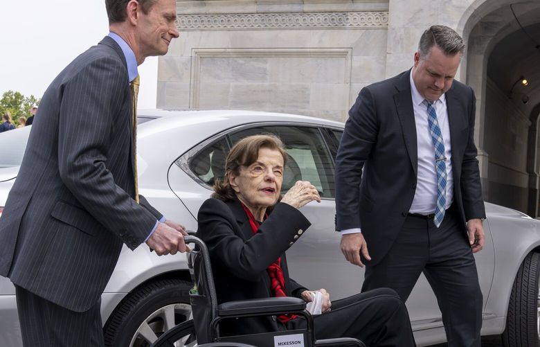 Sen. Dianne Feinstein, D-Calif., is assisted to a wheelchair by staff as she returns to the Senate after a more than two-month absence, at the Capitol in Washington, Wednesday, May 10, 2023. The 89-year-old California Democrat was out longer than expected which has slowed the push to confirm President Joe Biden’s judicial nominees. (AP Photo/J. Scott Applewhite) DCSA111 DCSA111