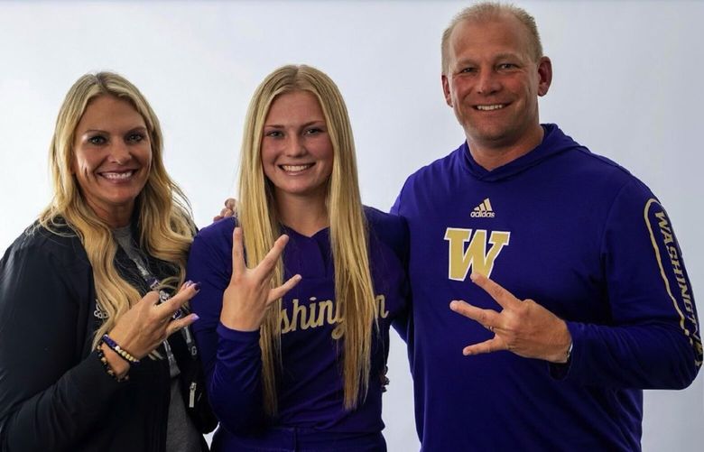Bellevue High School softball star Alexis DeBoer (center) poses with her parents Nicole and Kalen after announcing her commitment to UW softball. (Courtesy Kalen DeBoer)