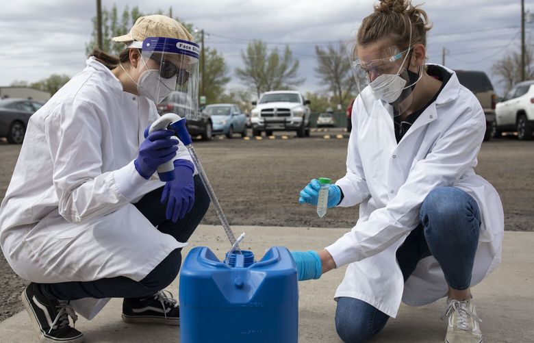 FILE – Engineering students collect wastewater samples at Colorado Mesa University in Grand Junction, Colo., on April 26, 2021. With other virus tracking efforts winding down, wastewater data is likely to become increasing important in the months ahead, scientists say. (Eliza Earle/The New York Times)