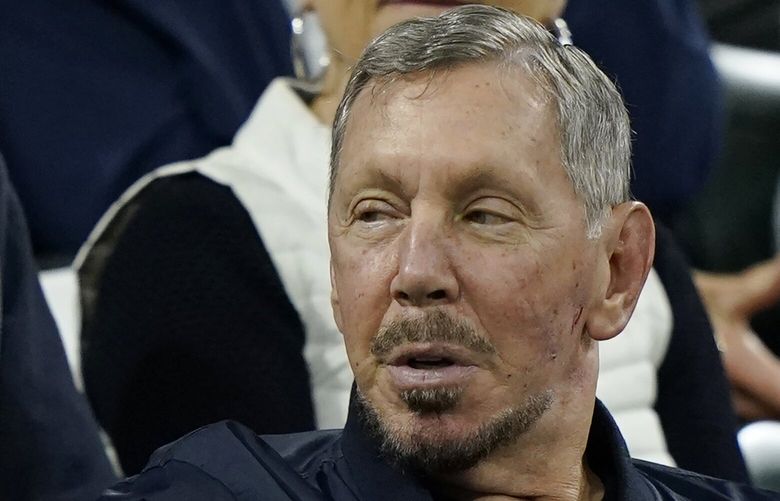 FILE – Larry Ellison, chairman of Oracle Corporation and chief technology officer, watches from the stands at the BNP Paribas Open tennis tournament Wednesday, Oct. 13, 2021, in Indian Wells, Calif. On Friday, May 12, 2023, a Delaware judge ruled in favor of Ellison in a shareholder lawsuit alleging that he coerced the technology’s company’s board into paying a grossly inflated price to acquire software company NetSuite Corp., in 2016. (AP Photo/Mark J. Terrill, File) NYSB527 NYSB527