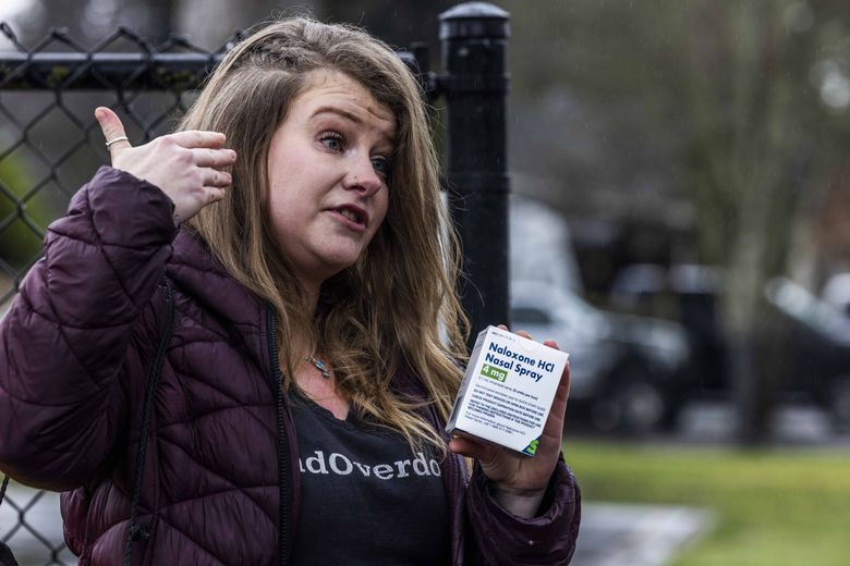 Wearing an “#EndOverdose” t-shirt, Amanda Kerstetter, a harm reduction specialist for South King County, teaches community members how to properly use Narcan in case of a fentanyl overdose. (Daniel Kim / The Seattle Times)
