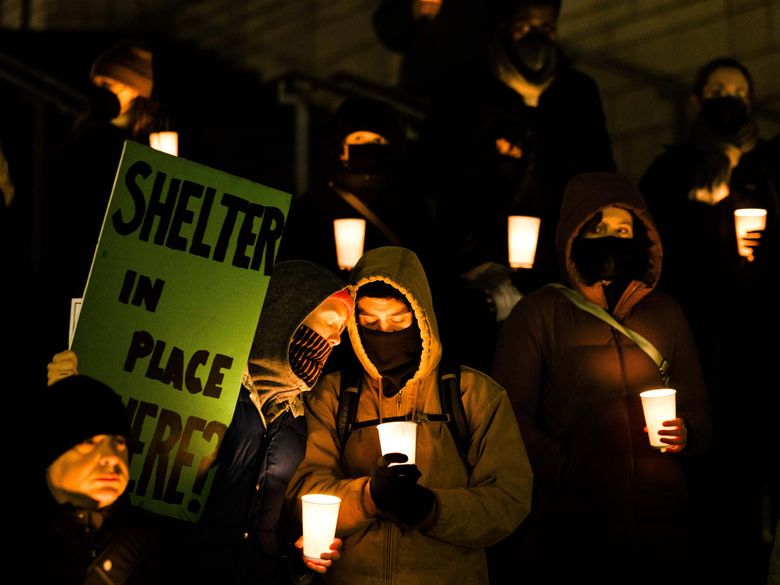 A candlelight vigil in December by Women in Black honors homeless people who died in 2022. Deaths by overdose have skyrocketed. (Daniel Kim / The Seattle Times)