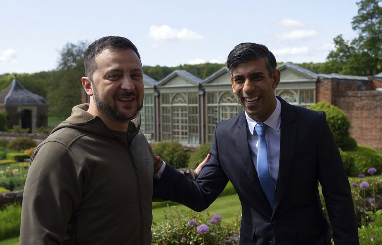 Britain’s Prime Minister Rishi Sunak, right, and Ukraine’s President Volodymyr Zelenskyy, laugh after a press conference in the garden at Chequers, the prime minister’s official country residence, in Aylesbury, England, Monday, May 15, 2023. Zelenskyy was in Britain Monday on his whirlwind European tour, as the staunch ally of Kyiv promised to give Ukraine hundreds more missiles and attack drones in an effort to change the course of the war. (Carl Court/Pool via AP) LGK153 LGK153