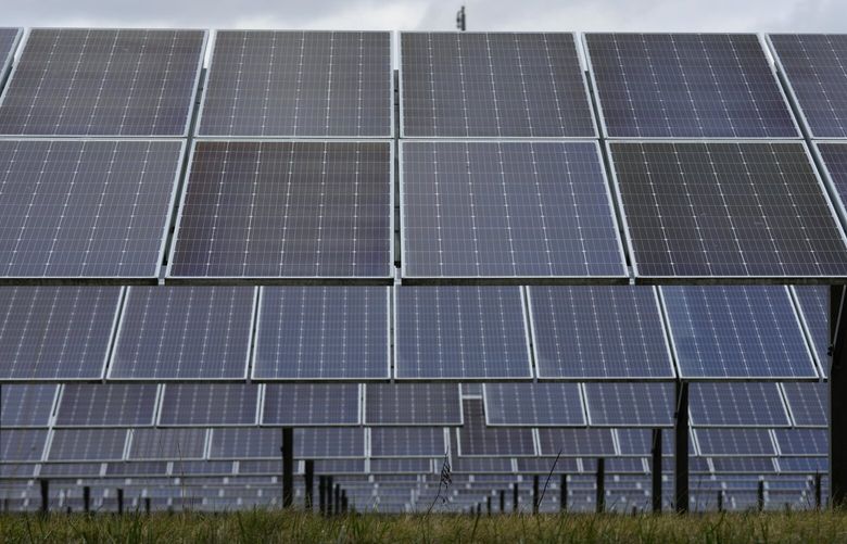 FILE – Solar panels work at the DTE O’Shea Solar Park in Detroit, Nov. 16, 2022. President Joe Biden vetoed on May 16, 2023, a congressional resolution that would have reinstated tariffs on solar panel imports from Southeast Asia, settling for now a long-running dispute over whether to punish China for trade violations that bypass U.S. rules limiting imports of cheap solar panels from Asia. (AP Photo/Paul Sancya, File) WX121 WX121