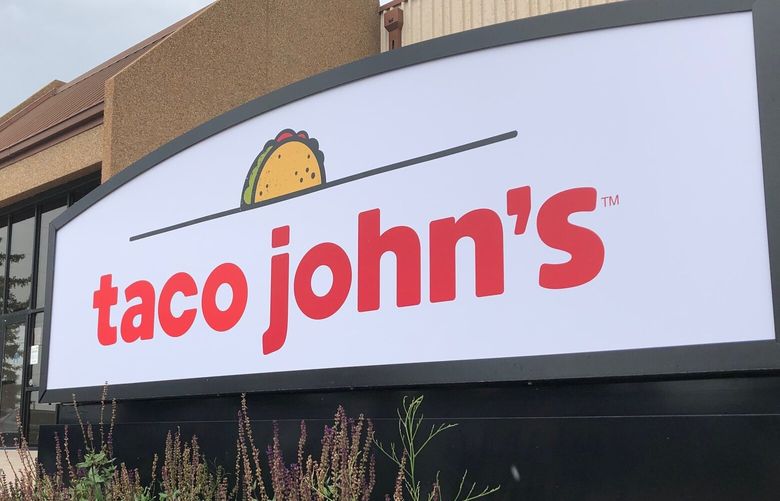 FILE – A sign stands outside the corporate headquarters of Cheyenne-based Taco John’s on Aug. 1, 2019, in Cheyenne, Wyo. Declaring a mission to liberate “Taco Tuesday” for all, Taco Bell asked U.S. regulators Tuesday, May 16, 2023, to force Wyoming-based Taco John’s to abandon its longstanding claim to the trademark. (AP Photo/Mead Gruver) NYAB208 NYAB208