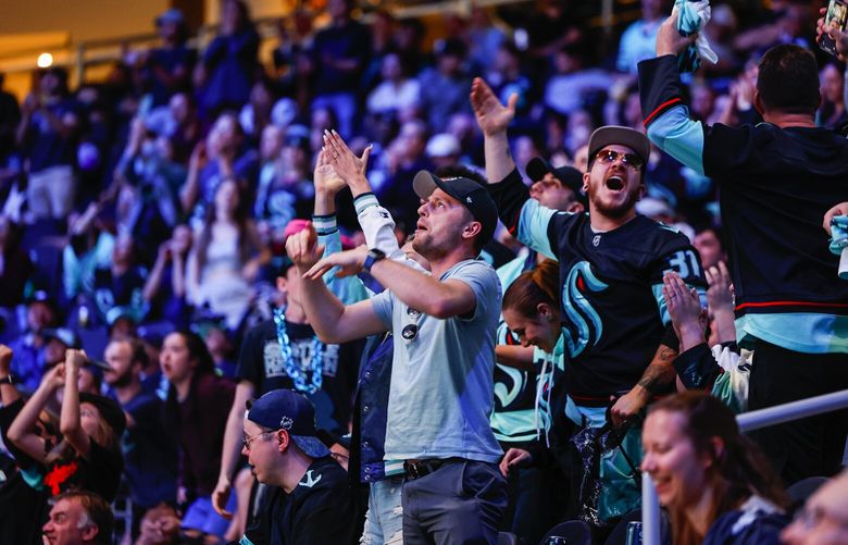 Kraken fans cheer their team’s comeback in the third period. 223854