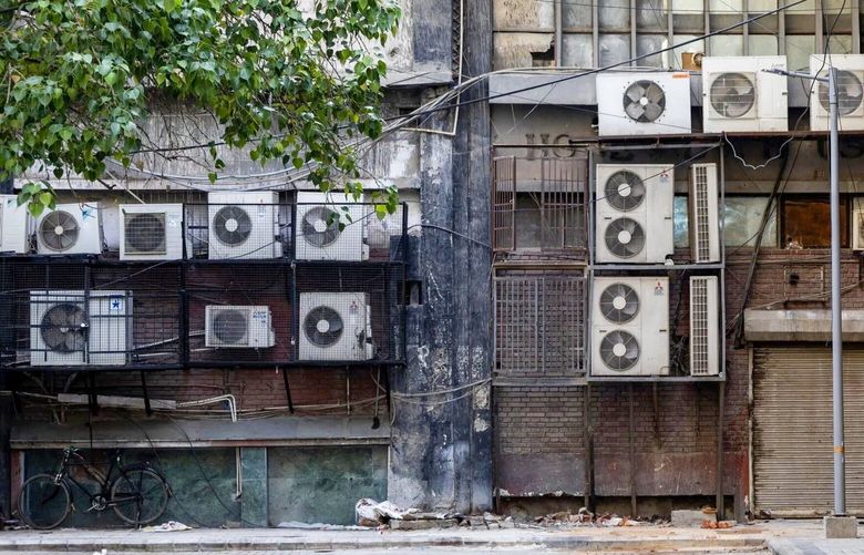 An old building with AC outdoor units in New Delhi.