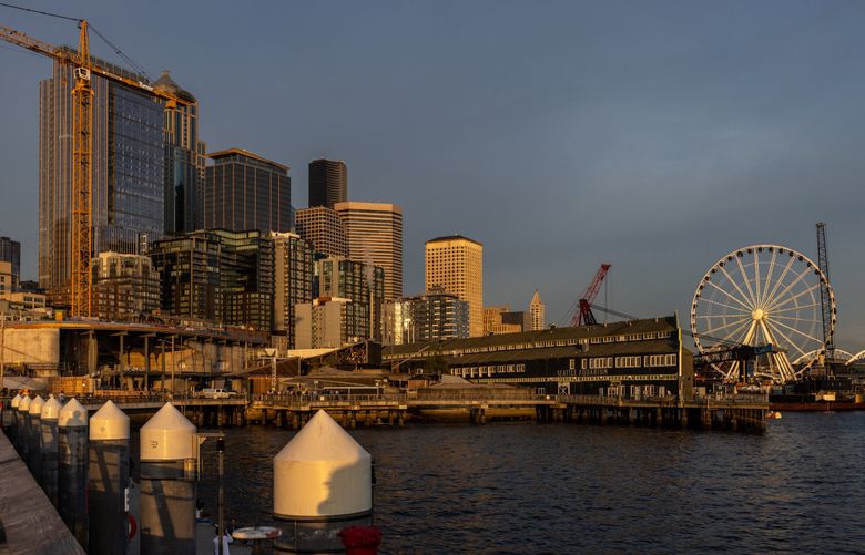 The ferris wheel and Seattle skyline Tuesday evening on May 16, 2023. (Kevin Clark / The Seattle Times)