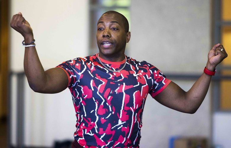 Kiyon Ross, choreographer and associate artistic director of Pacific Northwest Ballet, leads a rehearsal for a ballet named “…throes of increasing wonder” at the Phelps Center on Monday, May 8, 2023.