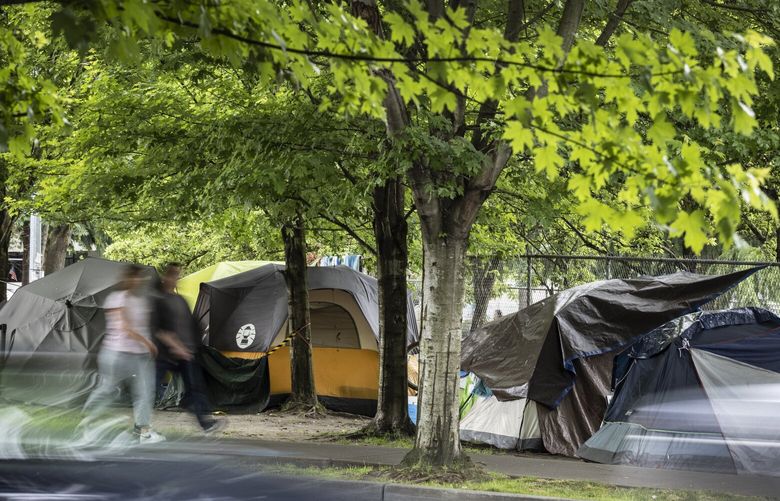Wed. June 22, 2022. King County Regional Homelessness Authority counted 13,368 homeless people in its 2022 Point-In-Time Count, a 14% increase from 2020. This small homeless camp sits on the busy W. Denny Way near Westlake Ave. N.  220763