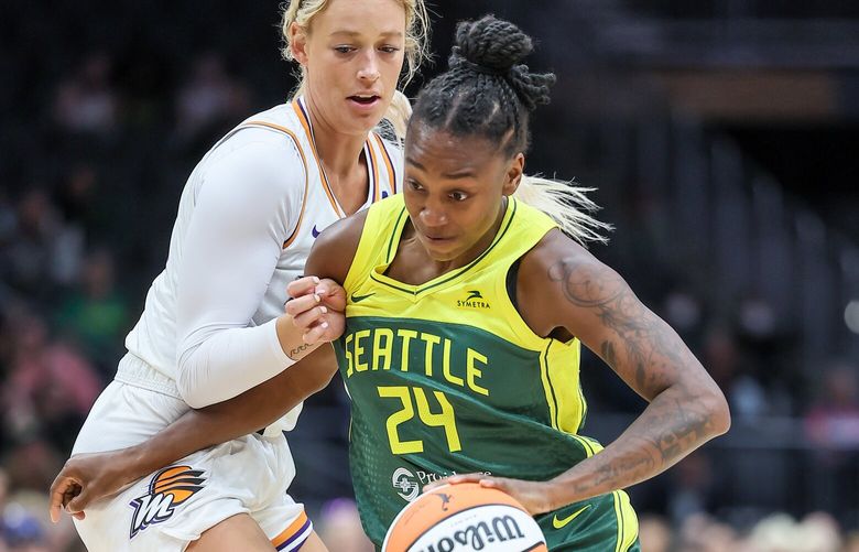 Seattle Storm’s Jewell Loyd drives the lane with Phoenix Mercury’s Sophie Cunningham defending Monday evening at Climate Pledge Arena in Seattle, Washington on May 8, 2023. The Storm lead 43-36 at the half.