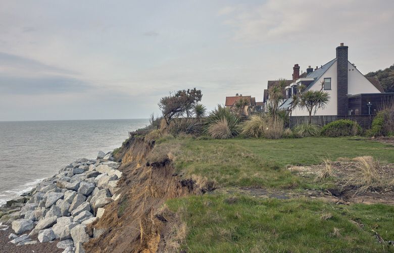 Lucy Ansbro’s home in the village of Thorpeness, England, on May 18, 2023. It is one of the thousands of homes along the eastern coast of England that are threatened by the rapidly eroding cliffs. (Andy Haslam/The New York Times)