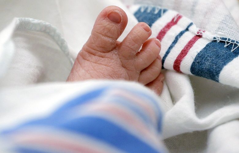FILE – The toes of a baby are seen DHR Health, July 29, 2020, in McAllen, Texas. Dutton and Wrenlee are on the rise but they’re no match for champs Liam and Olivia as the top baby names in the U.S. last year. (AP Photo/Eric Gay, File) NYET500