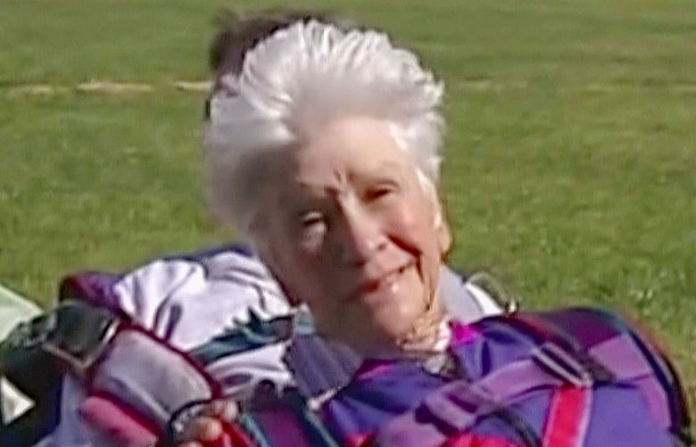 In this image made from video, Clare Nowland reacts following her skydive in Canberra, Australia April 6, 2008. Nowland, now 95, was in critical condition Friday, May 19, 2023, two days after police shocked her with a stun gun as she approached them with a walking frame and a steak knife in an Australian nursing home. (Australian Broadcasting Corp. via AP) CAN801 CAN801